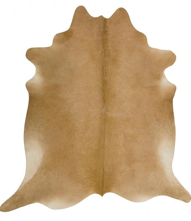 Natural beige cowhide rug on hardwood floor