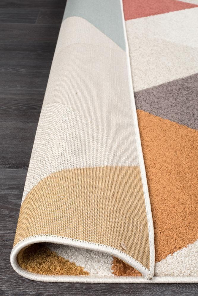 Dimensions in Triangle Blush Rug